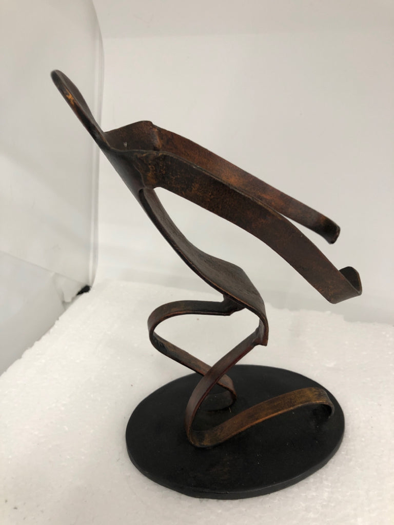 METAL HUMAN SCULPTURE ON STAND.