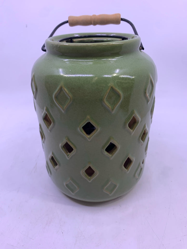 GREEN CERAMIC PIERCED CANDLE LANTERN.