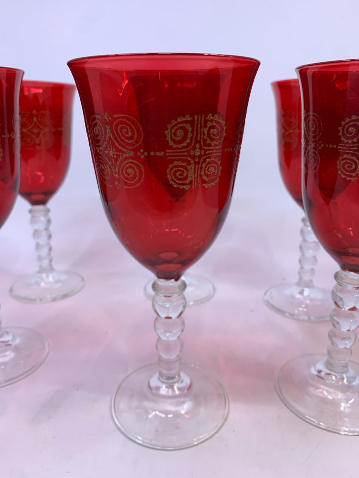 8 RED WINE GLASSES W/ GOLD DETAILS.