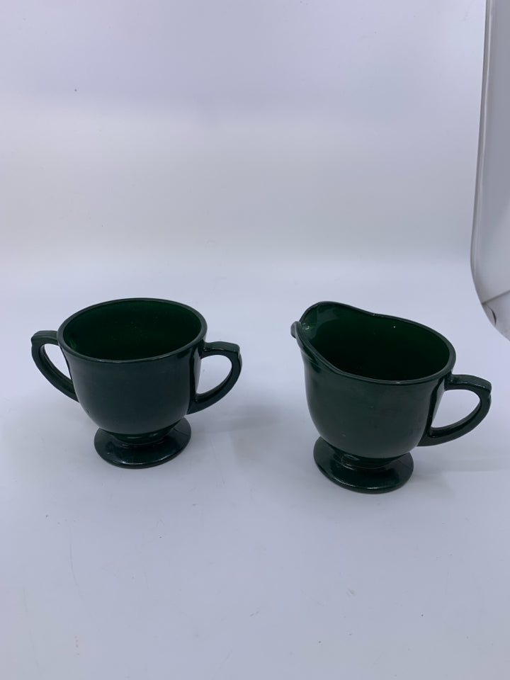 FOOTED DARK GREEN PAINTED GLASS CREAM/SUGAR SET.