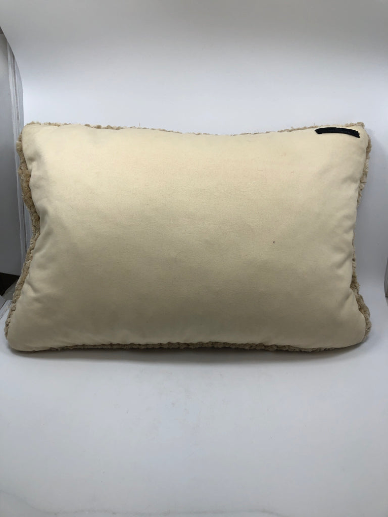 FUZZY TAN THROW PILLOW.