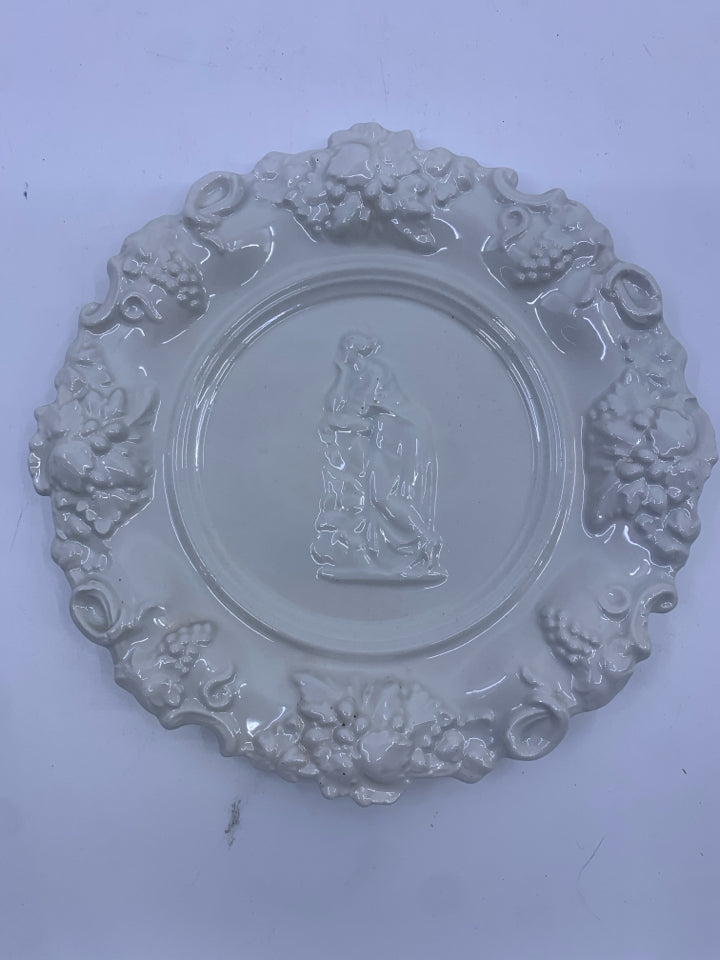 VTG EMBOSSED PLATE W WOMAN ON FRONT.