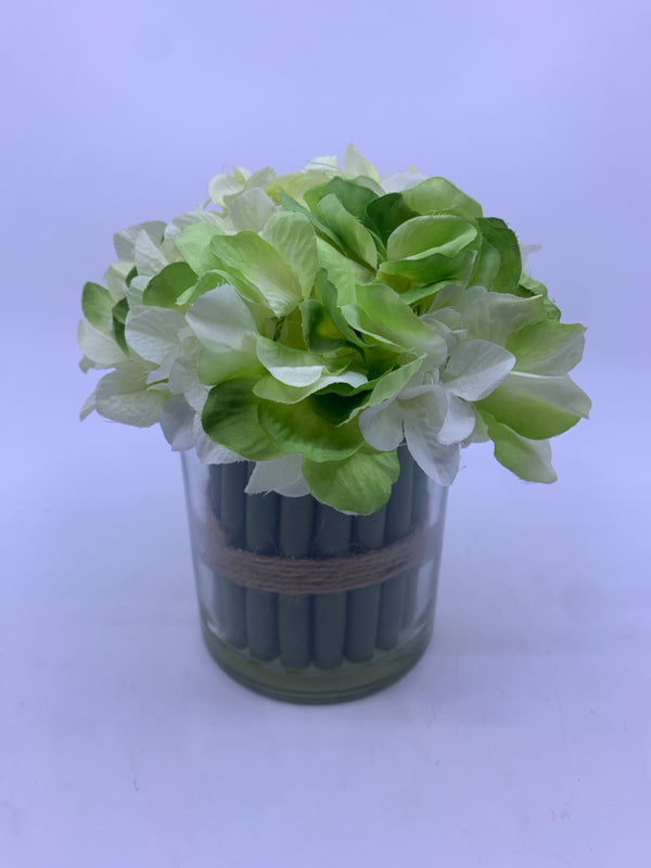 WHITE/GREEN FAUX FLOWERS IN GLASS PLANTER.
