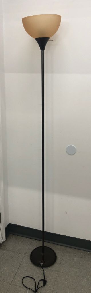 TALL BROWN FLOOR LAMP W TAN SHADE.