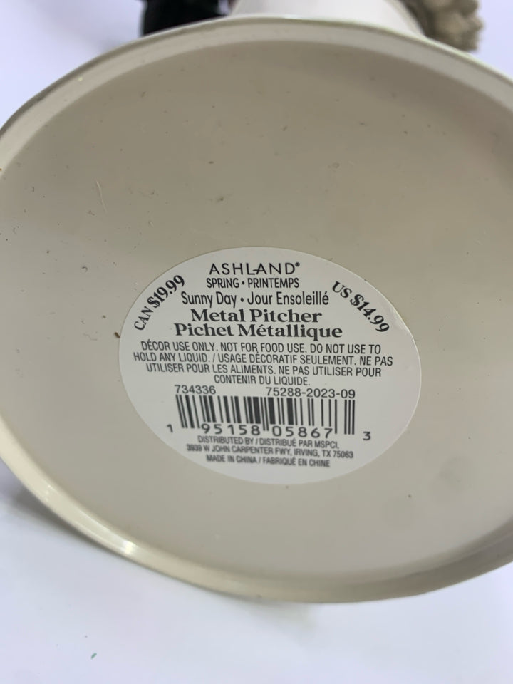 WOOD FLORALS IN CREAM METAL PITCHER.