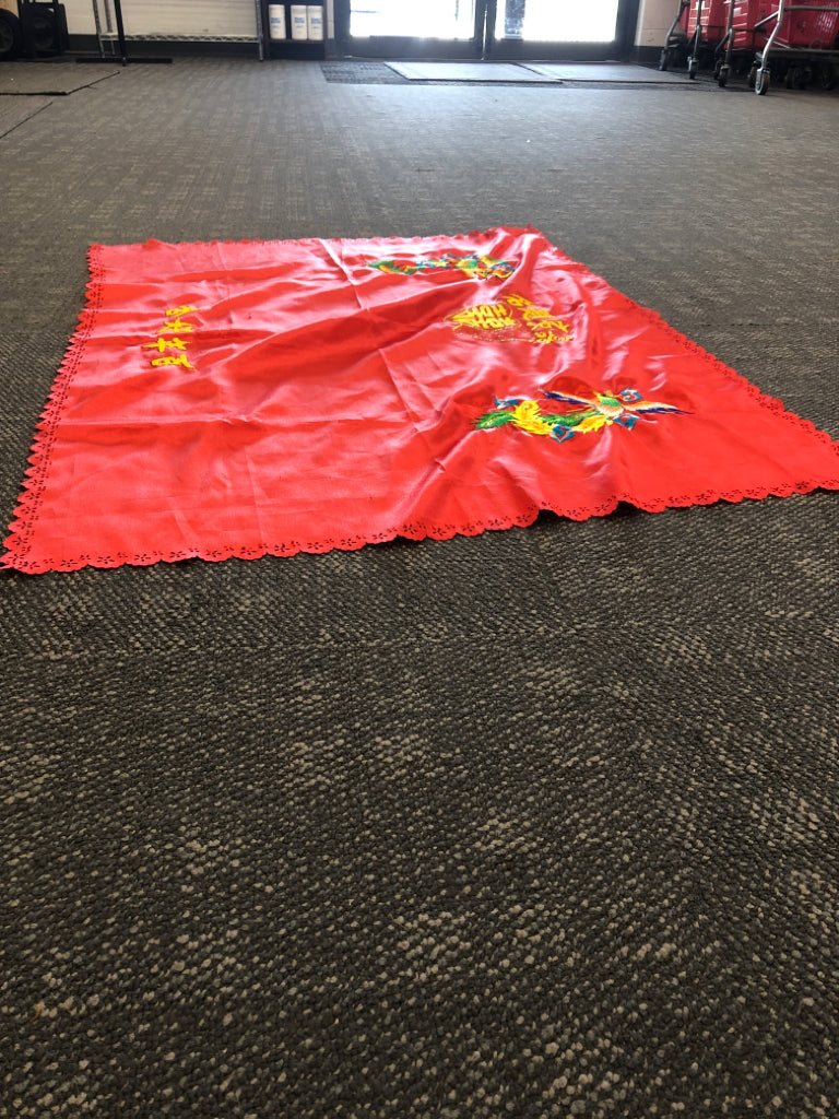 RED TABLE CLOTH W CHINESE DRAGON AND LETTERS.