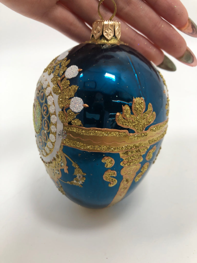 BLUE & GOLD EGG SHAPED ORNAMENT.