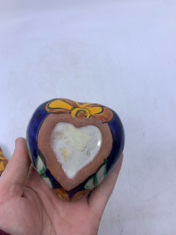 HEART SHAPED TERRA COTTA DARK BLUE W/ ORANGE DETAILS.