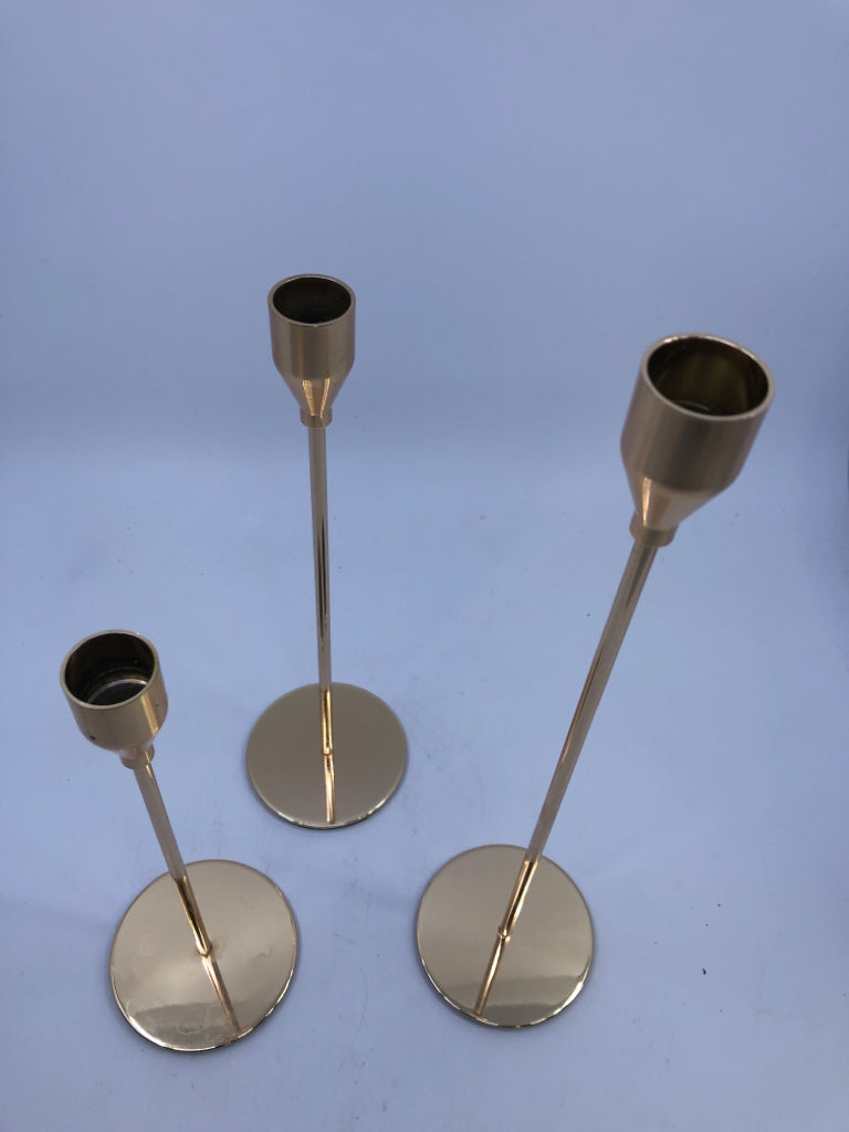 3 GOLD TAPER CANDLE HOLDER.