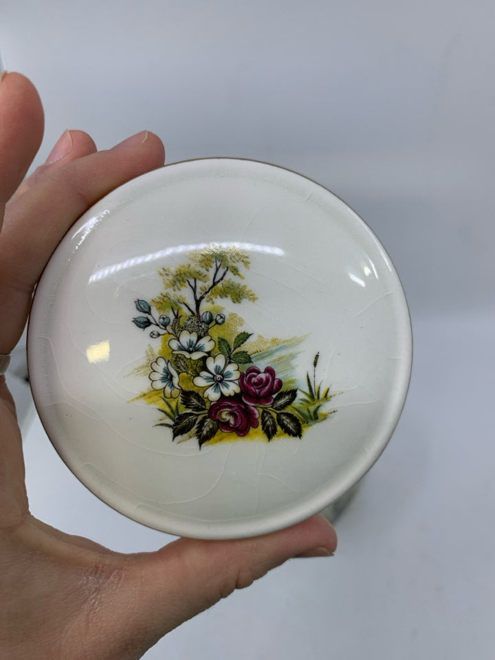 VTG WHITE SQUARE GINGER JAR W/ POND SCENE LOOKING OUT TO HOUSE GOLD DETAILS.