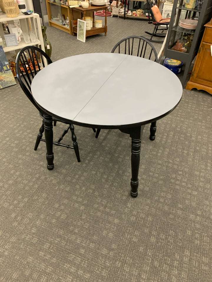 ROUND BLACK PAINTED WOOD TABLE W/ MATTE GRAY TOP 2 CHAIRS.