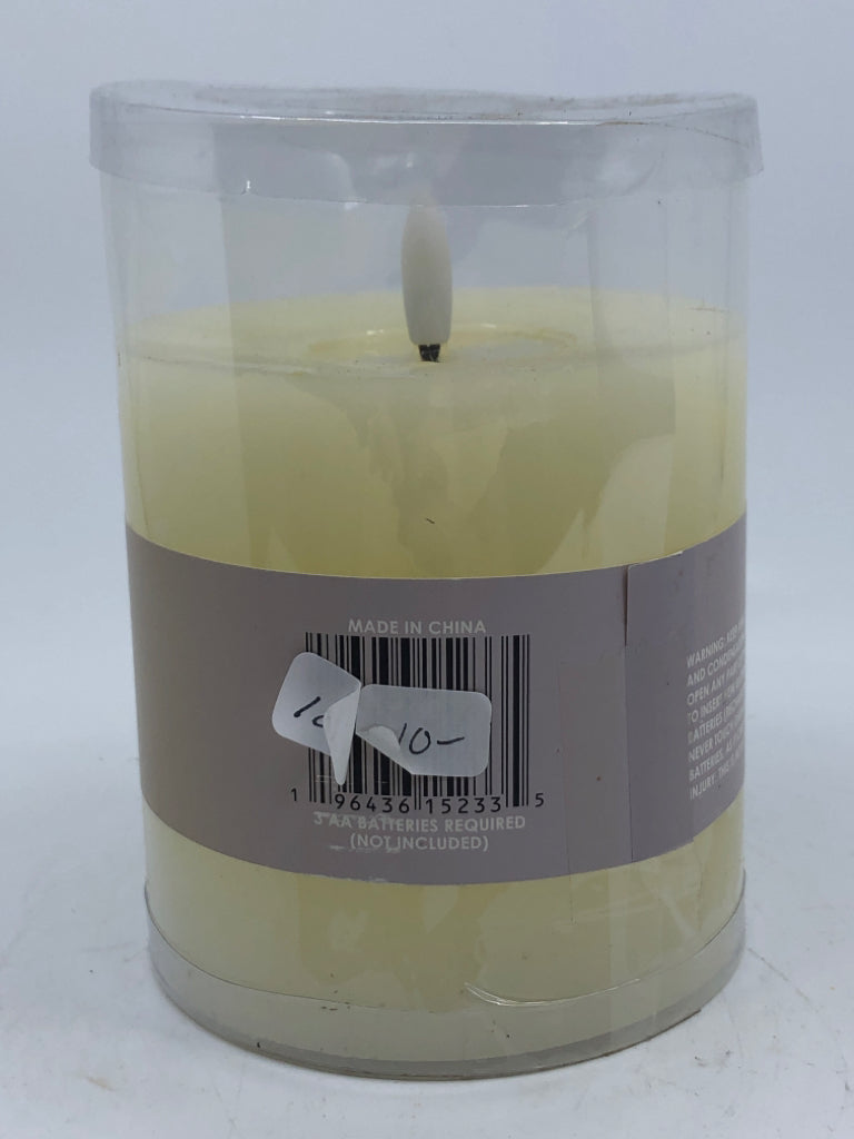NIP FAUX BATTERY CANDLE.