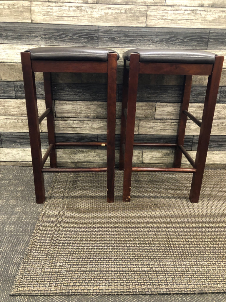 2 FAUX LEATHER UPHOLSTERED WOOD STOOLS.