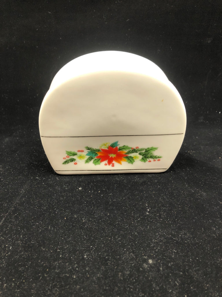 WHITE POINSETTIA NAPKIN HOLDER.