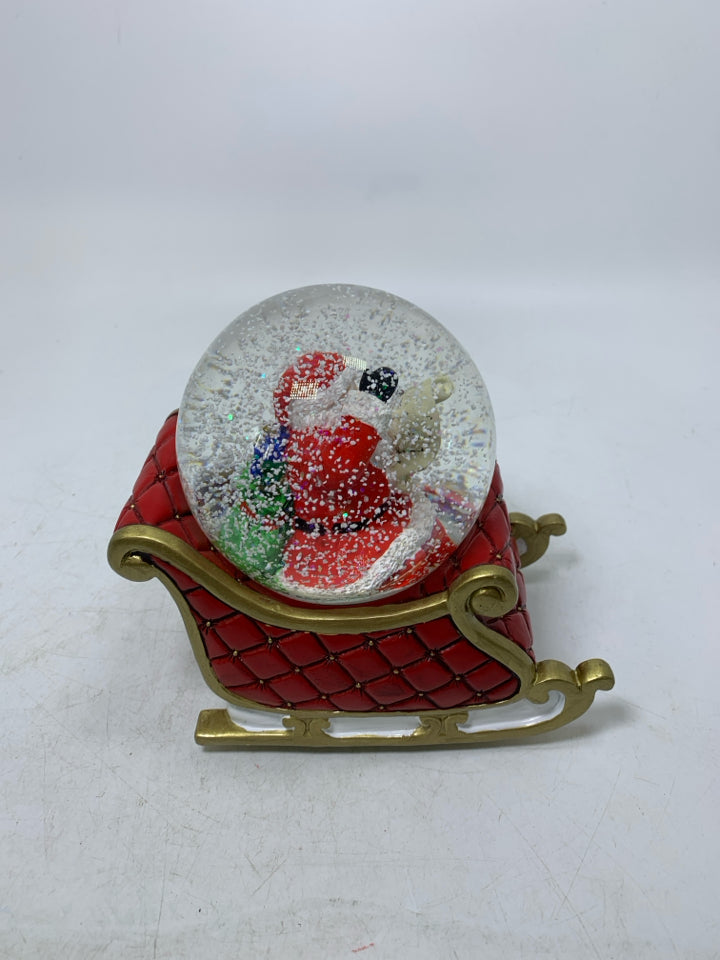 RESIN SLAY W/ SANTA READING LIST SNOW GLOBE.