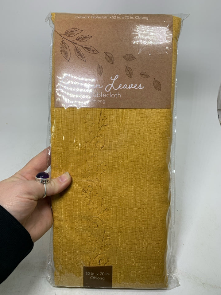 NIP YELLOW CUTWORK TABLECLOTH OBLONG.