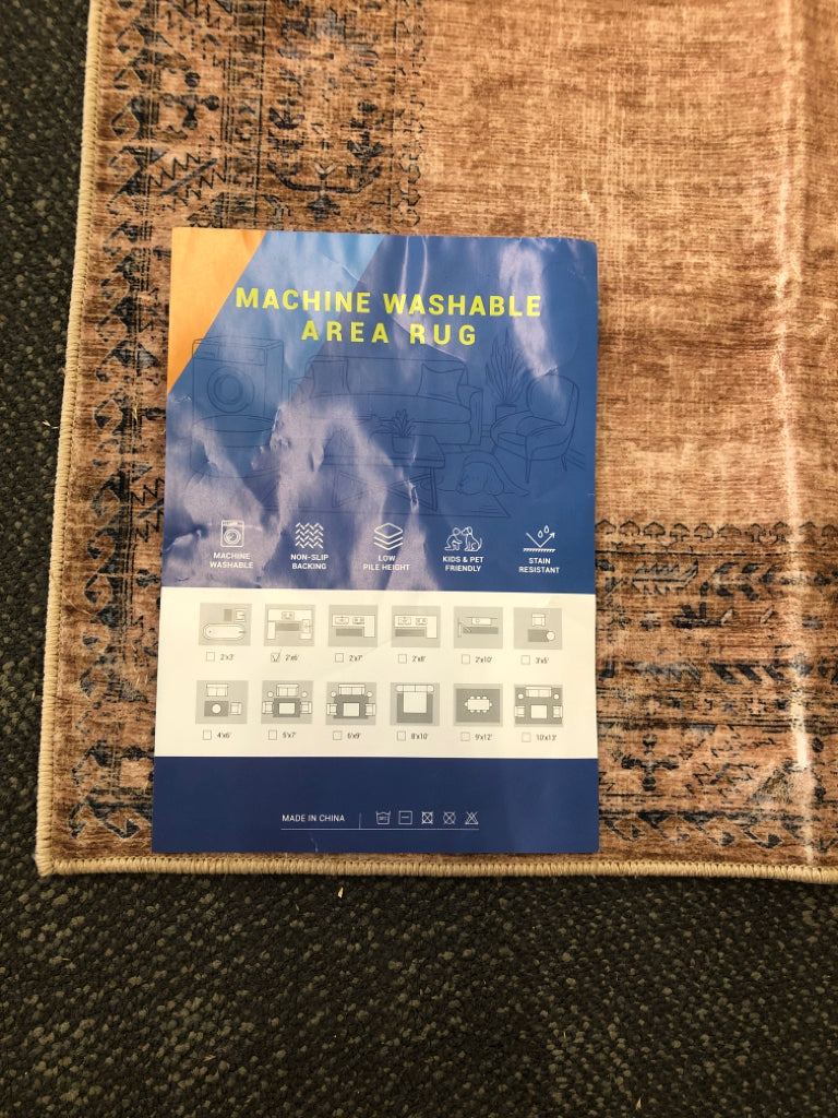 TAN, BLUE BORDER MACHINE WASHABLE RUG RUNNER.