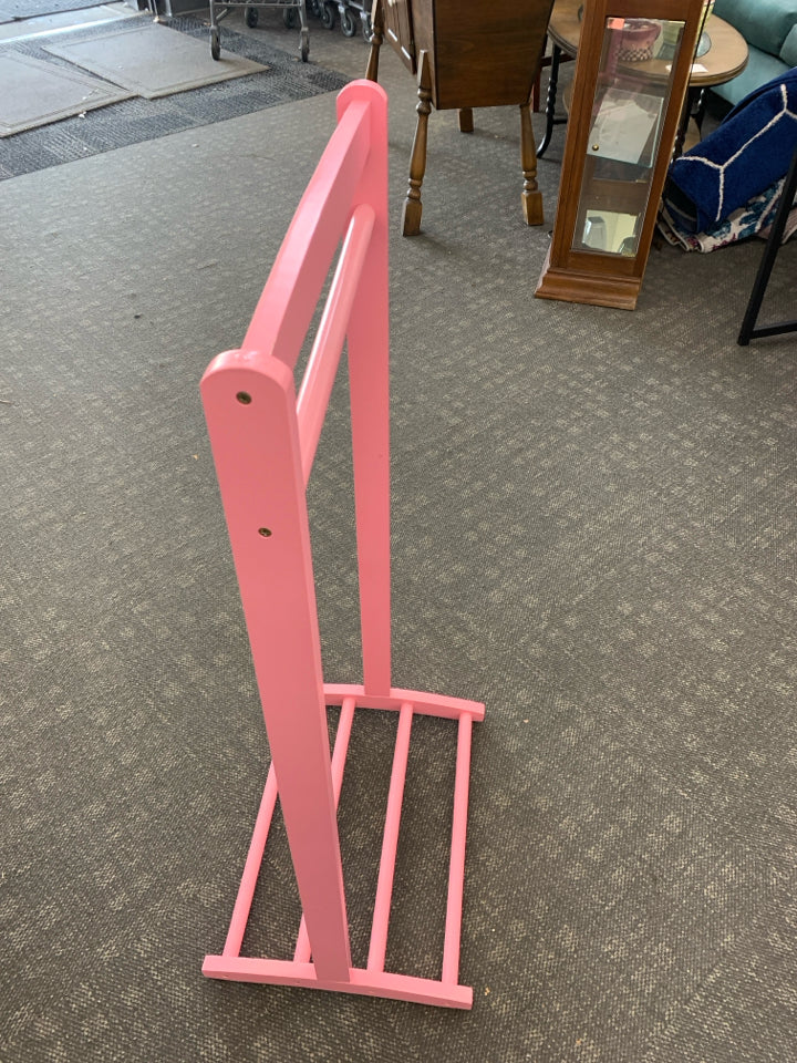 LIGHT PINK KIDS CLOTHES RACK.