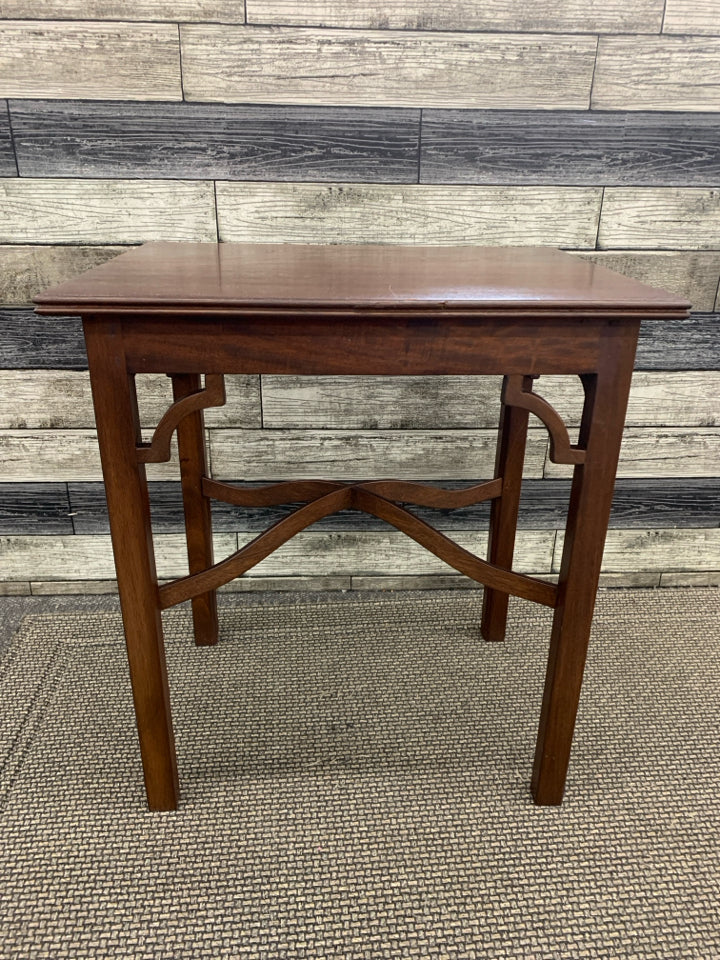 RED WOODEN SIDE TABLE.