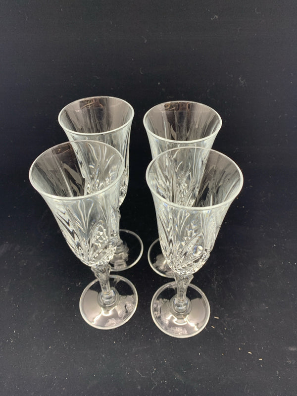 4 CUT GLASS CHAMPAGNE FLUTES.