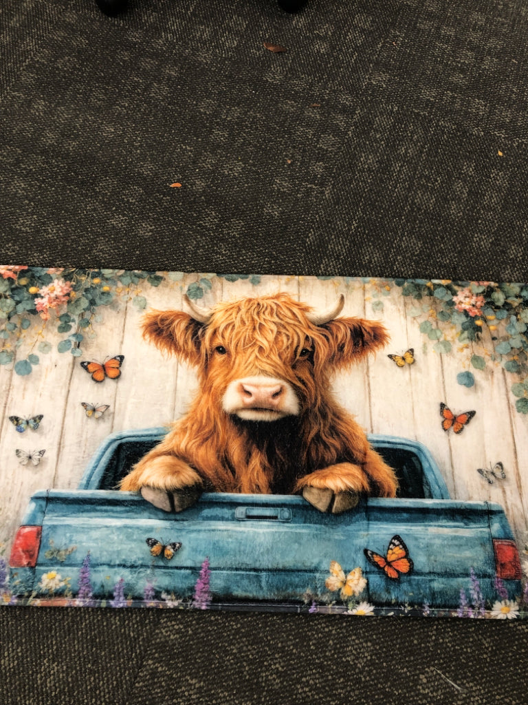 PLUSH HIGHLAND COW ACCENT RUG.
