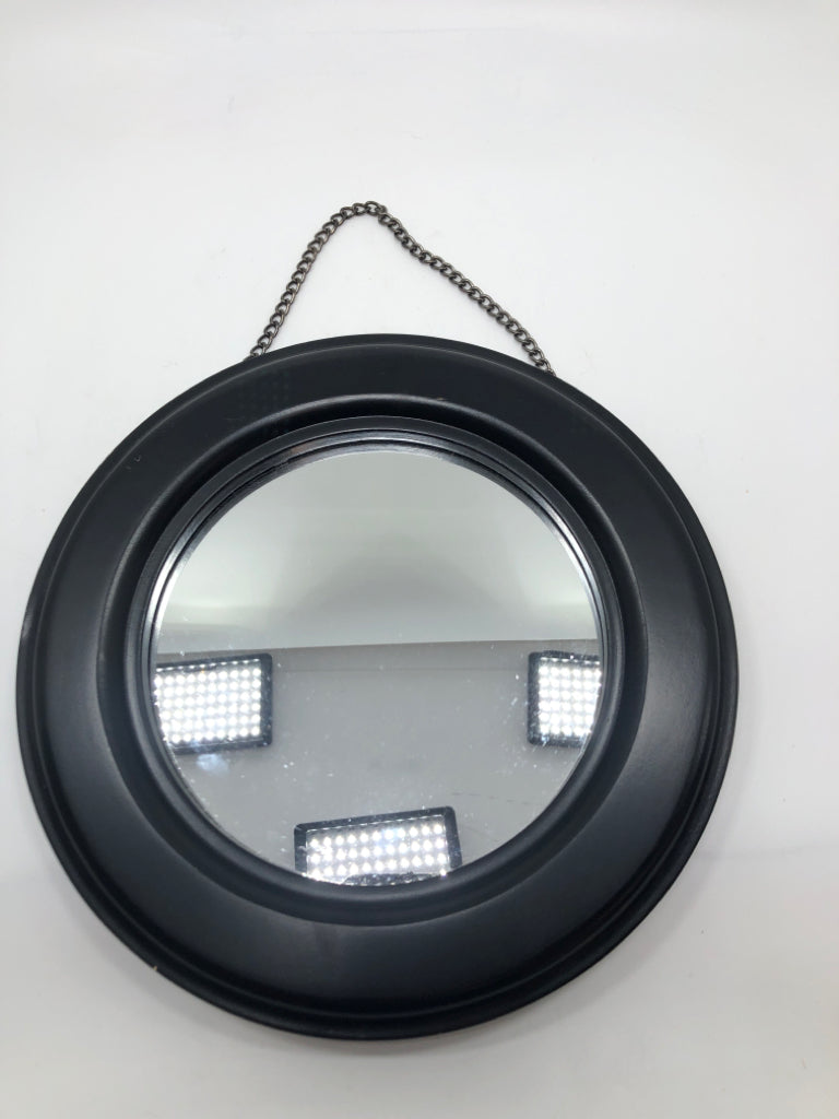 ROUND BLACK HANGING MIRROR.