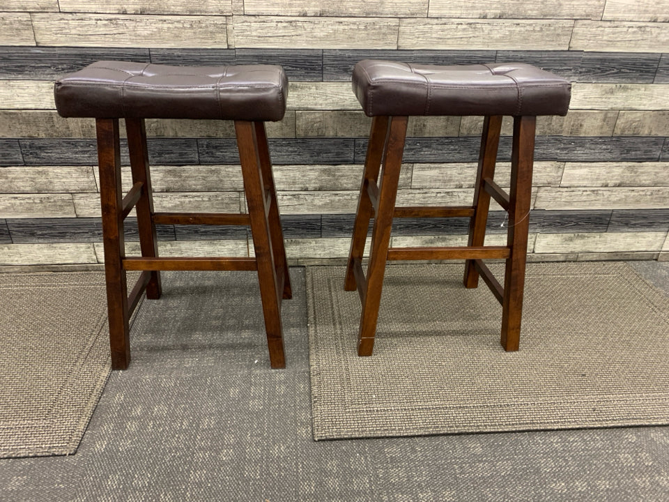 2 LEATHER SADDLE BAR STOOLS.