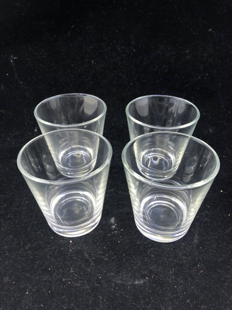 4 CLEAR JUICE GLASSES.