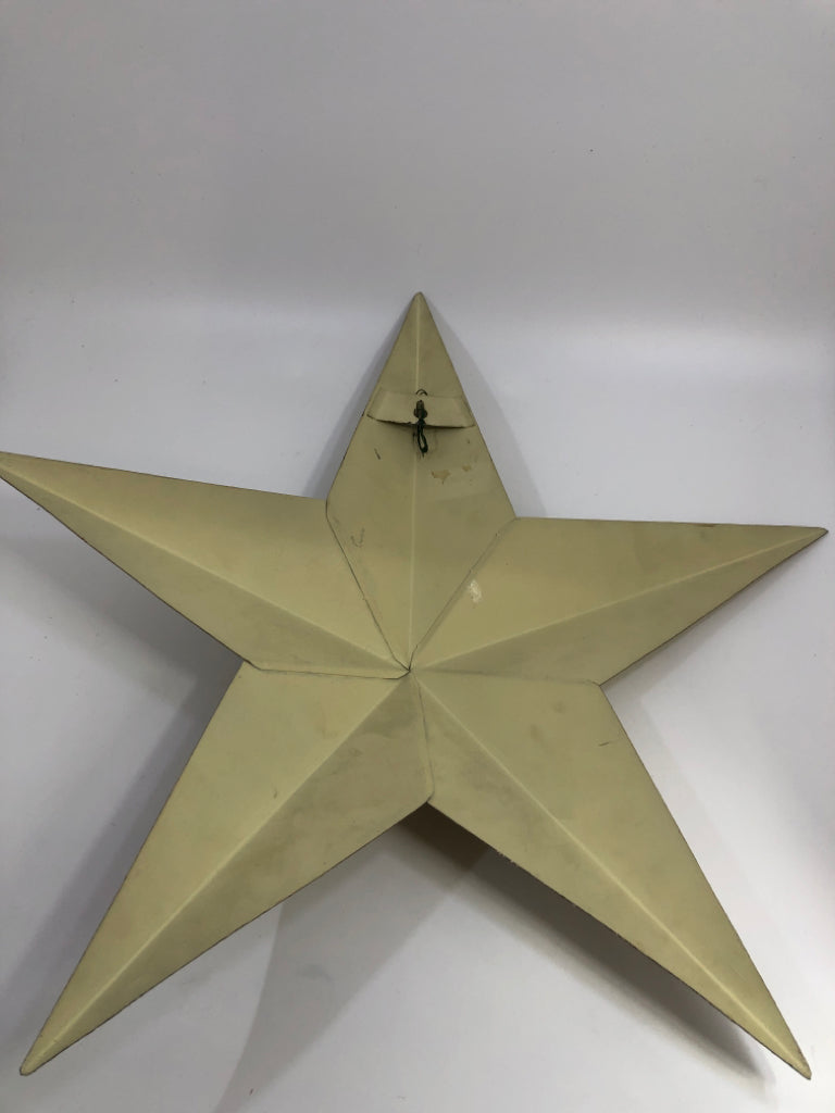 TAN METAL STAR WALL DECOR.