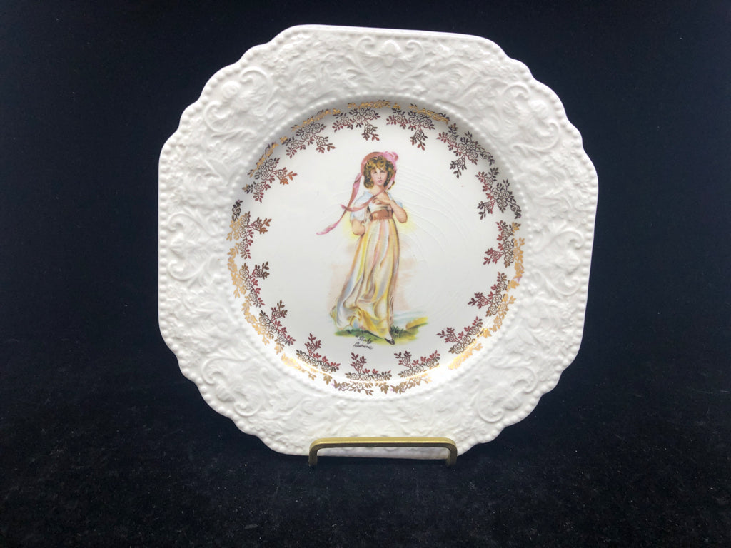 EMBOSSED PINK PLATE W GOLD ACCENTS.