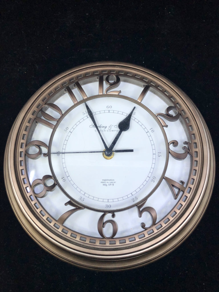 SMALL STERLING & NOBLE BRONZE COLORED CLOCK.