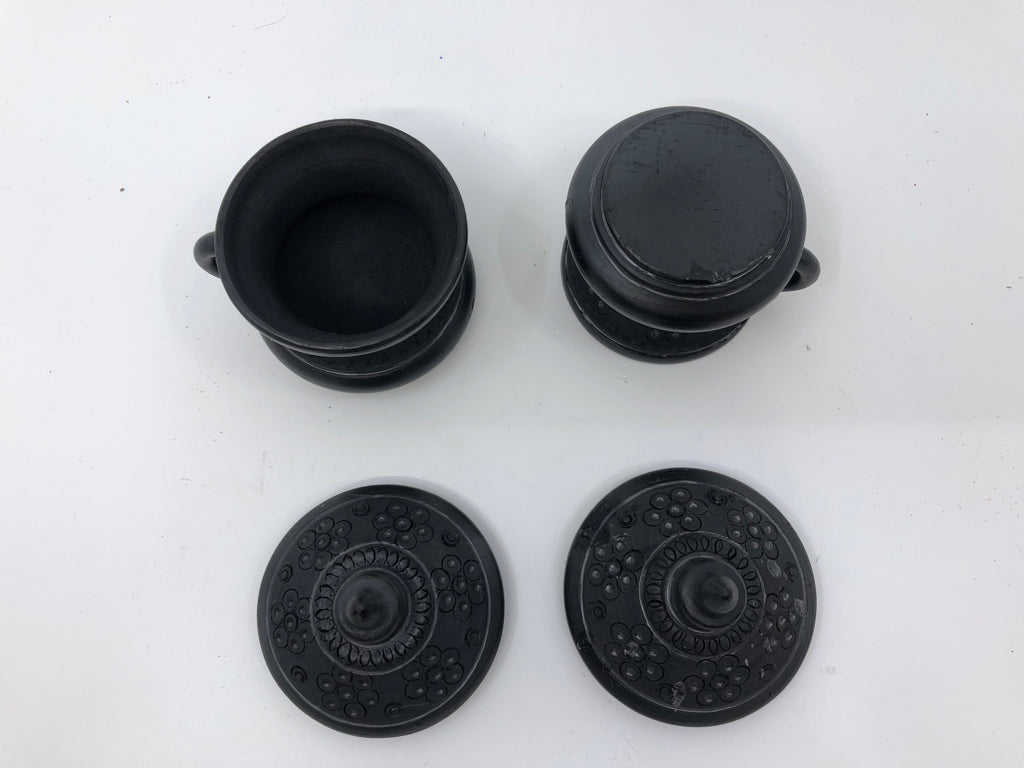 6PC BLACK CARVED TEA SET -PITCHER, CUPS W LID, SUGAR AND CREAMER ON PLATE.