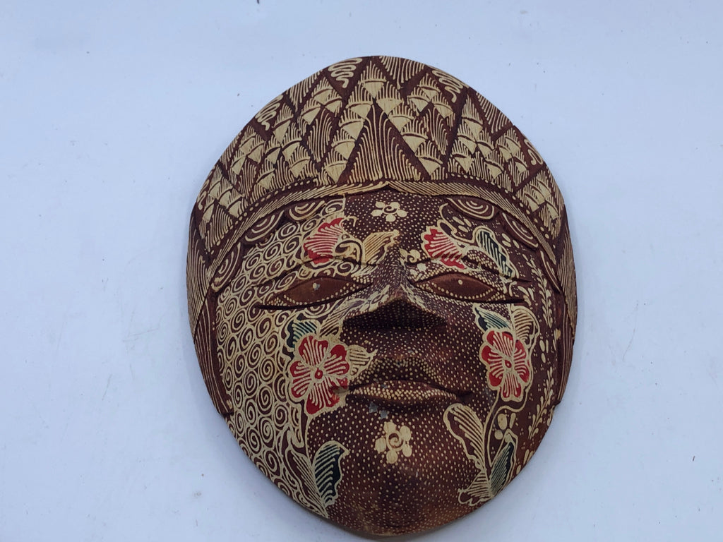 MAROON CARVED MASK WALL HANGING.