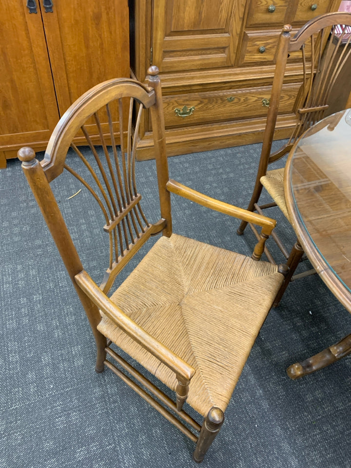 ROUND WOOD DINNER TABLE W/ 4 CHAIRS WOVEN SEATS GLASS TOP.