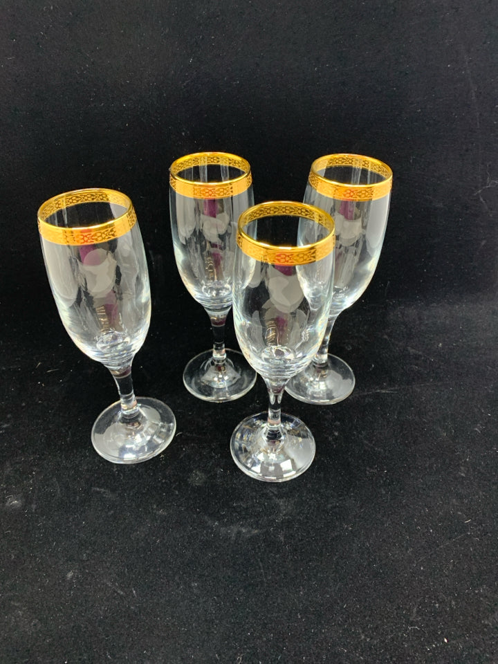4 GOLD RIMMED GLASS CHAMPAGNE FLUTES.