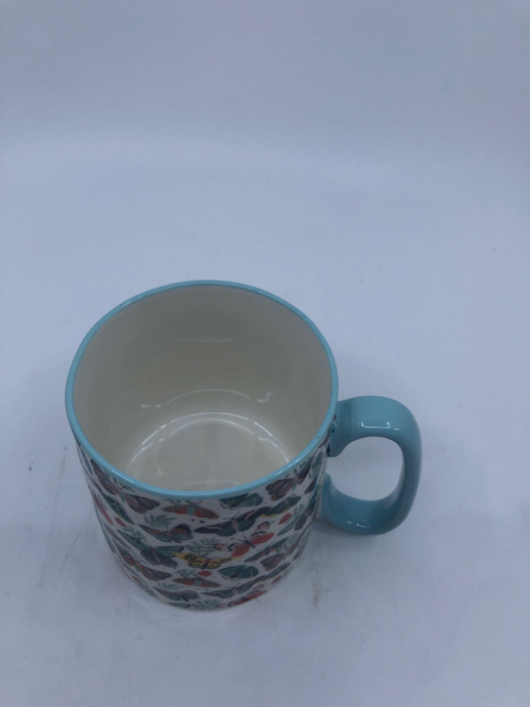 LIGHT BLUE W/ COLORED MOTHS MUG.