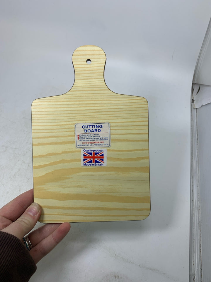 SMALL WHITE CUTTING BOARDS W/ HERBS & JAR.