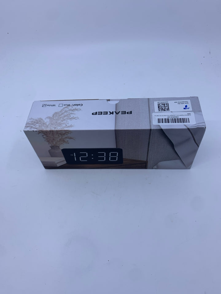 NIB WHITE DIGITAL CLOCK W/ CHARING PORT.