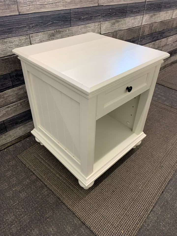 WHITE NIGHT STAND W/ DRAWER BLACK HARDWARE.