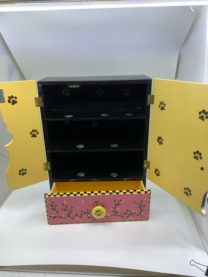 BLACK/WHITE PAINTED CAT W/ YELLOW BACKGROUND W/DRAWER WALL HANGING.