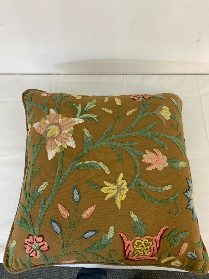 BROWN EMBROIDERED FLORAL PILLOW.