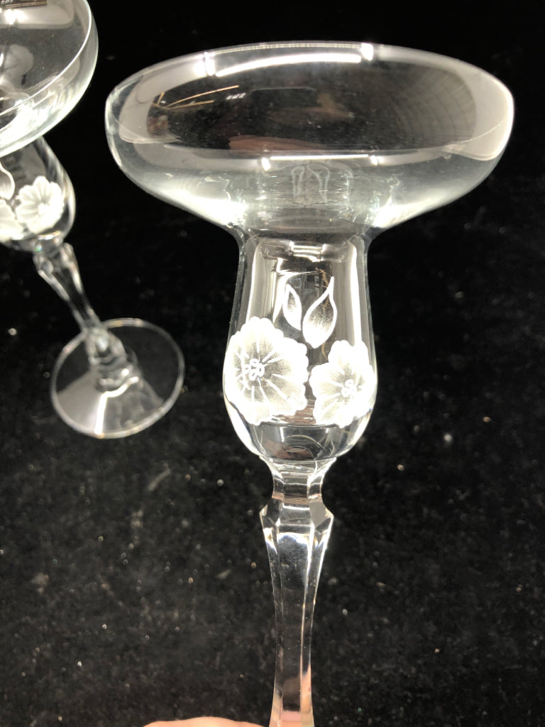 2 FOOTED GLASS FLORAL ETCHED TAPER CANDLE HOLDERS.