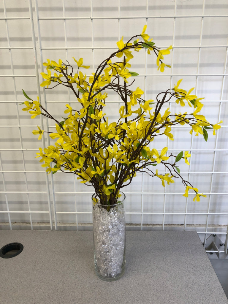 FORSYTHIA BOUQUET IN CLEAR GLASS VASE W/CRYSTAL FILLER.