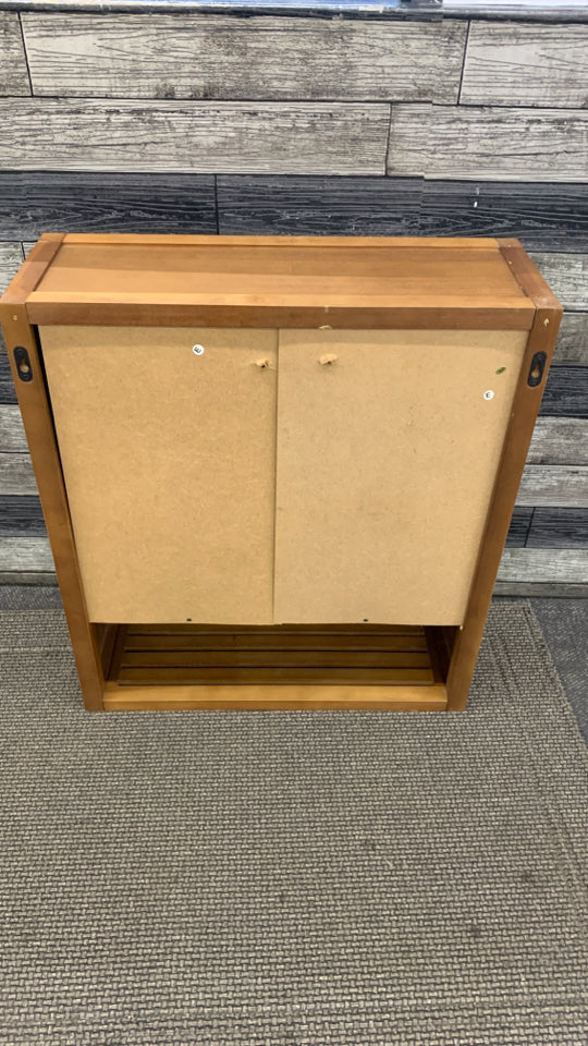 WOOD BATHROOM CABINET W/SLOTTED DOORS 3 SHELVES.