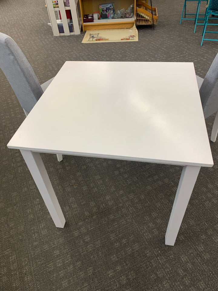 WHITE TABLE W/2 GRAY UPHOLSTERED CHAIRS.
