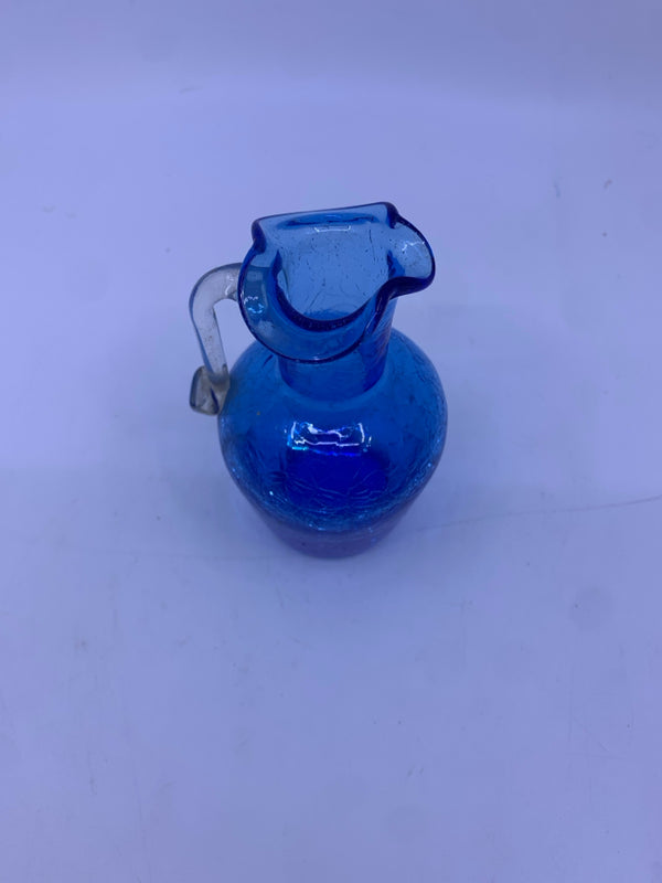 BLUE CRACKED GLASS VASE W/ HANDLE AND SPOUT.