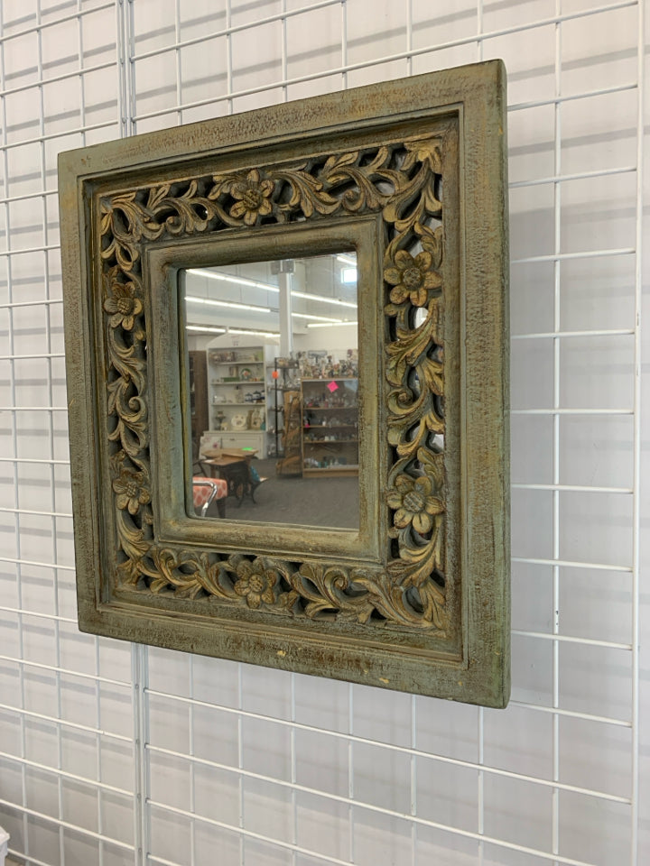 DISTRESSED TEAL MIRROR W/FLORAL ACCENTS.