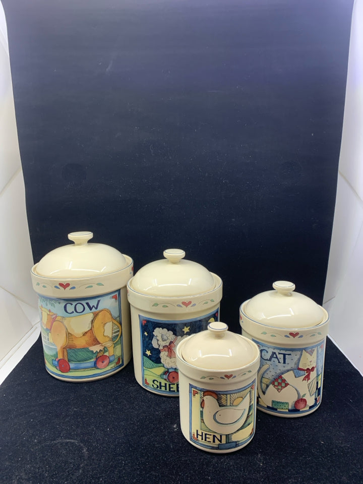 4 PRIMITIVE ANIMAL CANISTERS.