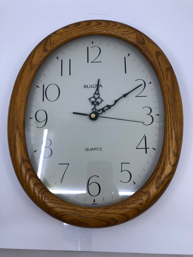 OVAL WOOD BULOVA CLOCK.