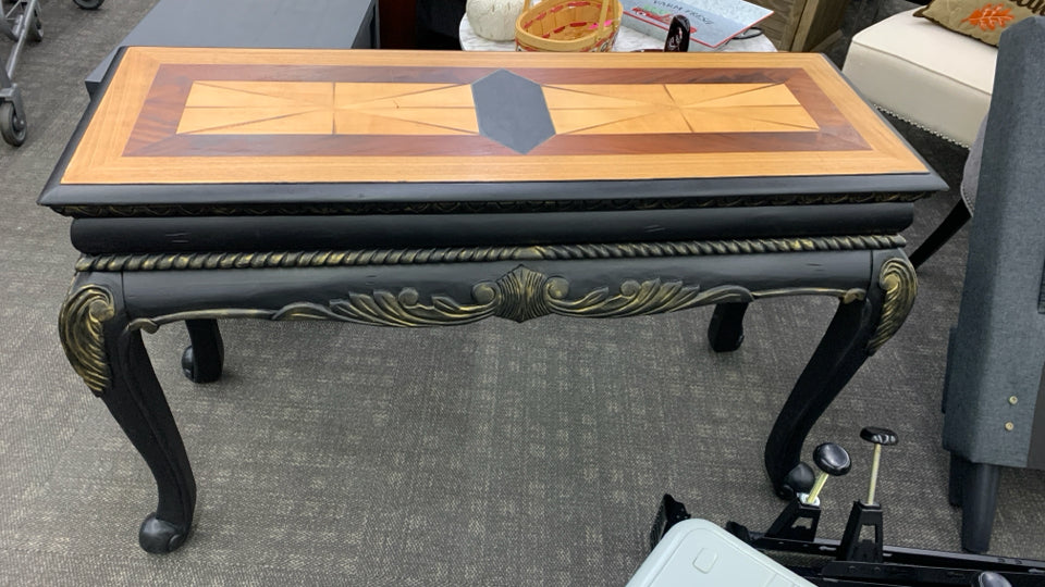 BLACK CONSOLE TABLE W/ TWO TONED STAINED INLAY.